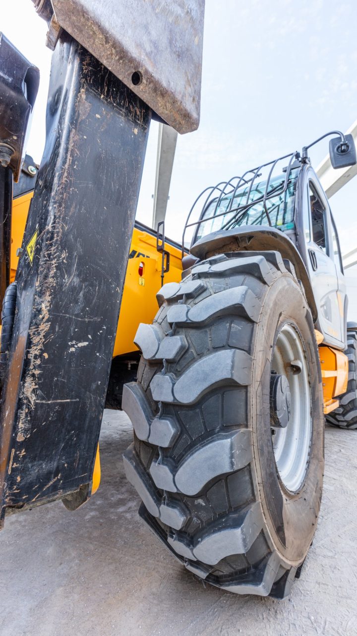 Industrial warehouse construction. Rotating telehandler vehicle